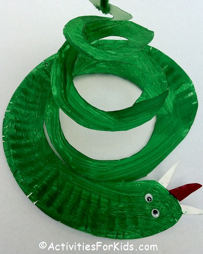 Easy and inexpensive to make, the classic paper plate snake craft for kids.  Kids crafts for St. Patrick's Day, Chinese New Year or Bible Study of Adam and Eve.  ActivitiesForKids.com 