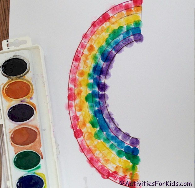Use water color paints to create a pretty rainbow.  Rainbow printable at ActivitiesForKids.com 