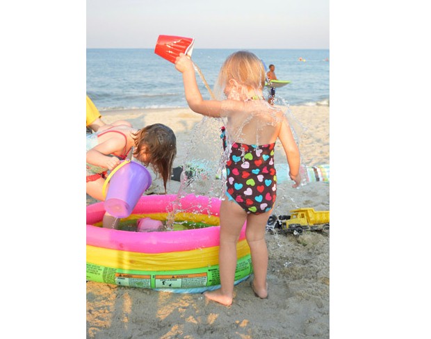 Fun Beach Activities with Kids Use an Inflatable Pool